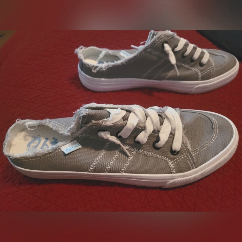 Grey distressed slide-style shoes